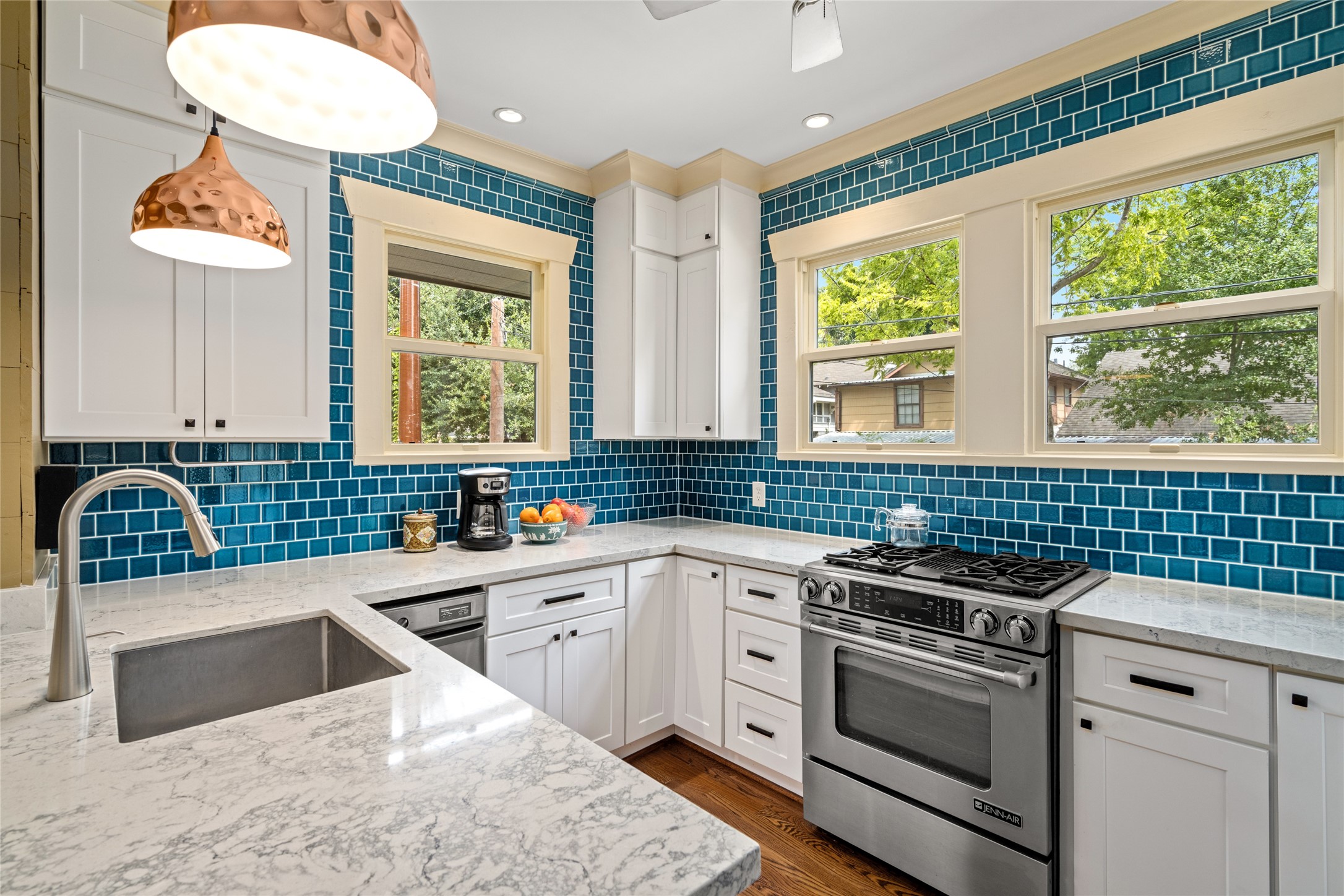 4502 Stanford Street Houston, TX 77006 - Photo 17 of 39 a kitchen that has a sink and a stove in it