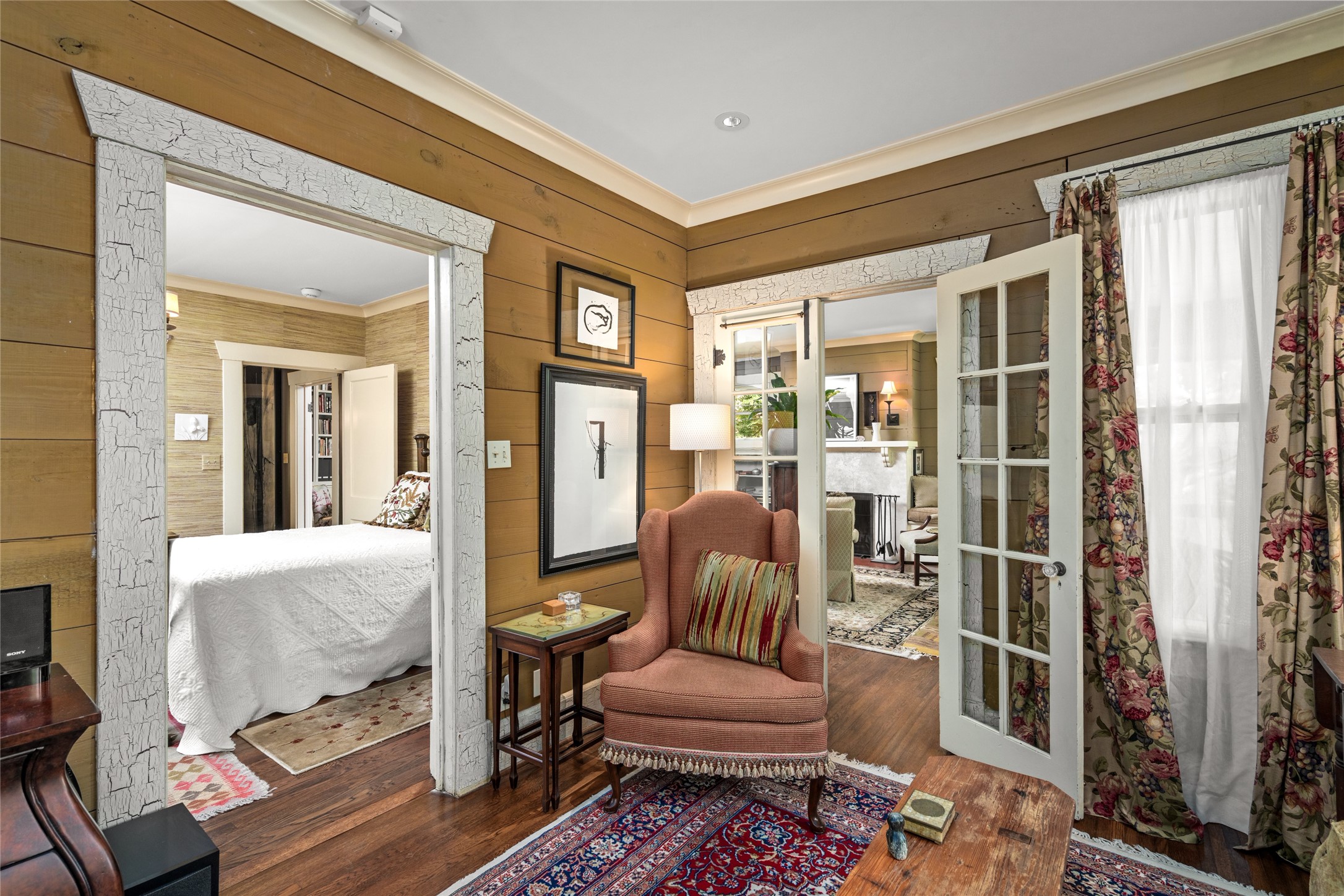4502 Stanford Street Houston, TX 77006 - Photo 23 of 39 a living room with furniture and a floor to ceiling window