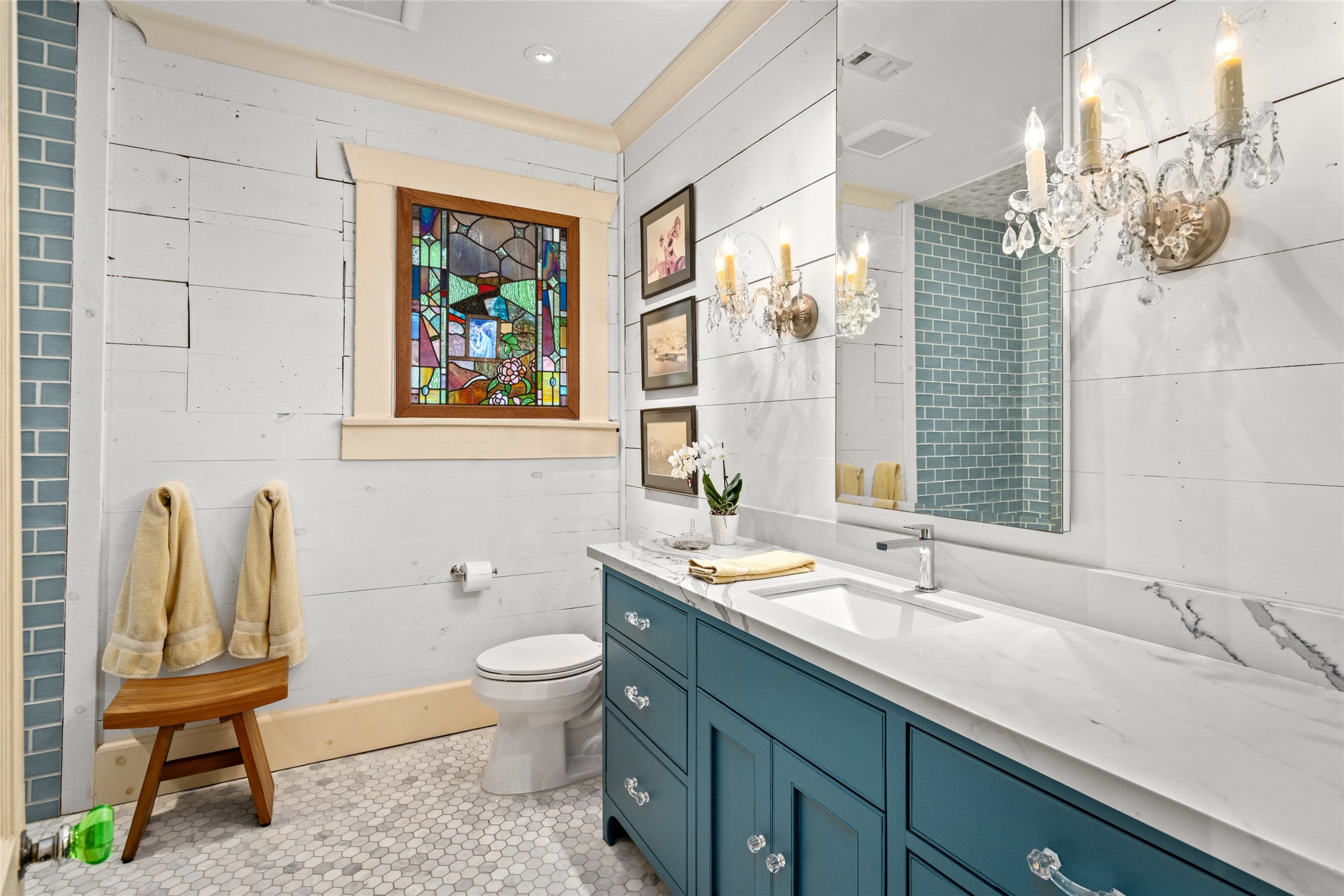 4502 Stanford Street Houston, TX 77006 - Photo 26 of 39 a bathroom with a granite countertop sink a toilet and a large mirror