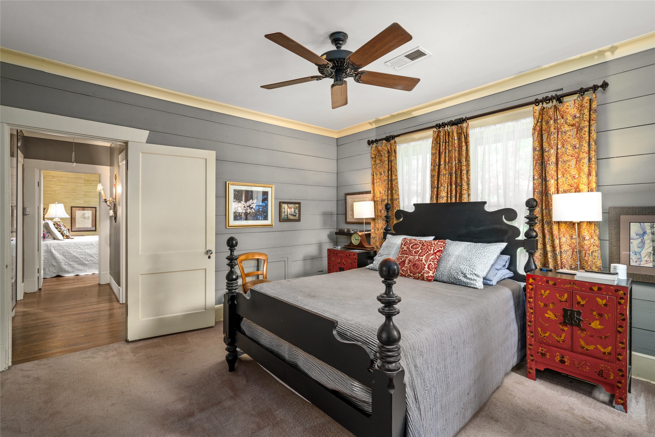 4502 Stanford Street Houston, TX 77006 - Photo 28 of 39 a bedroom with a bed and wooden floor