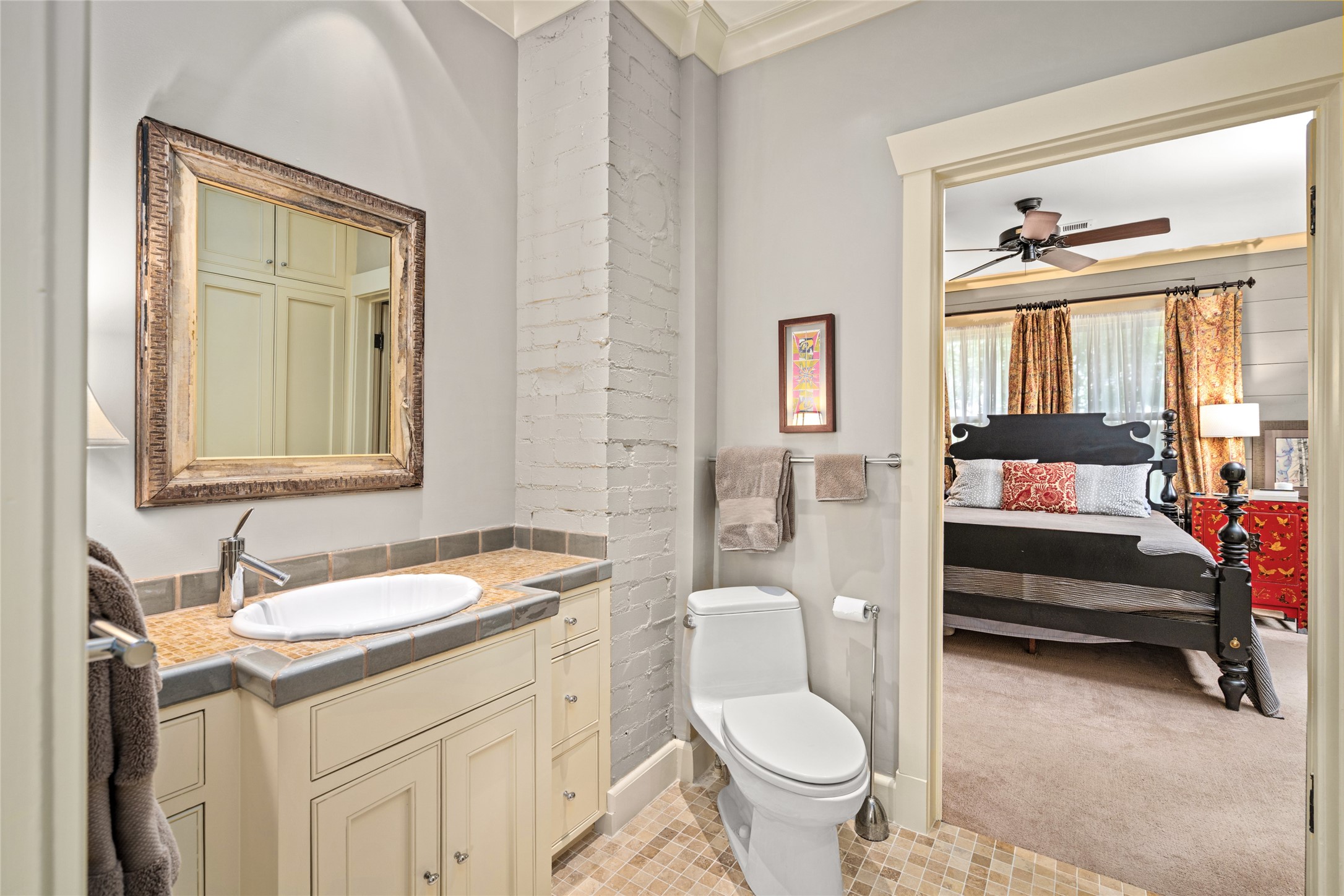4502 Stanford Street Houston, TX 77006 - Photo 30 of 39 a bathroom with a sink toilet and a mirror