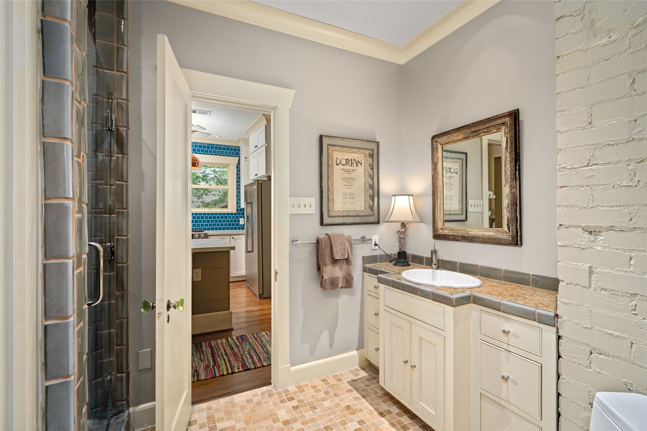 4502 Stanford Street Houston, TX 77006 - Photo 32 of 39 a spacious bathroom with a sink and a mirror