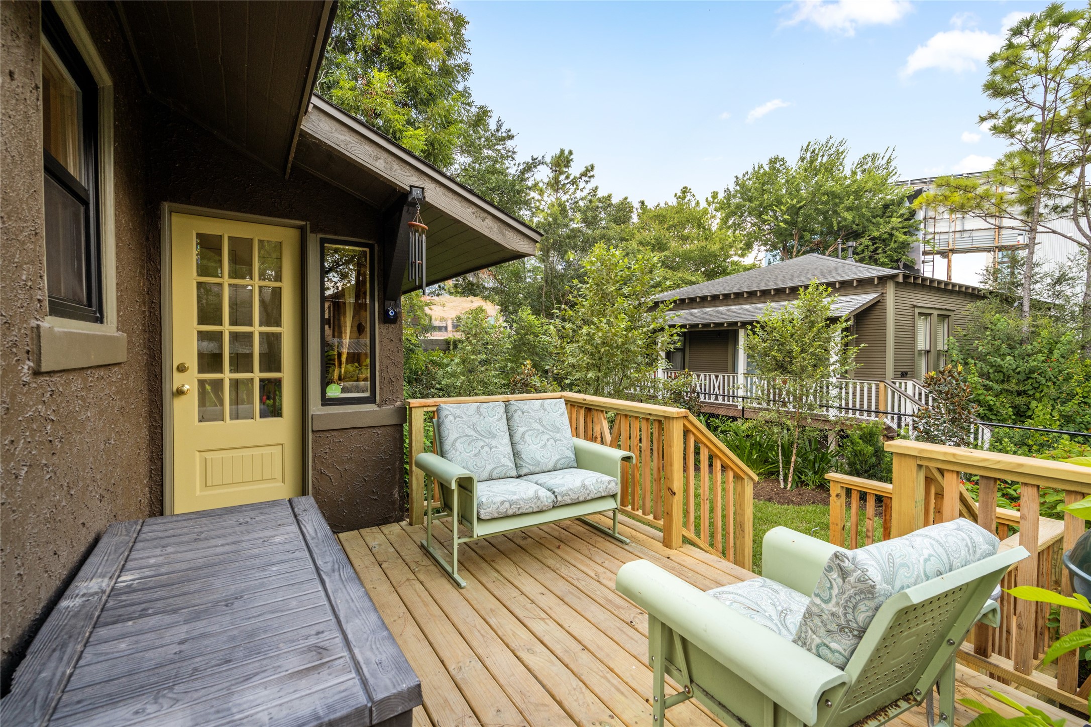 4502 Stanford Street Houston, TX 77006 - Photo 33 of 39 a view of a deck with couches wooden floor and fence
