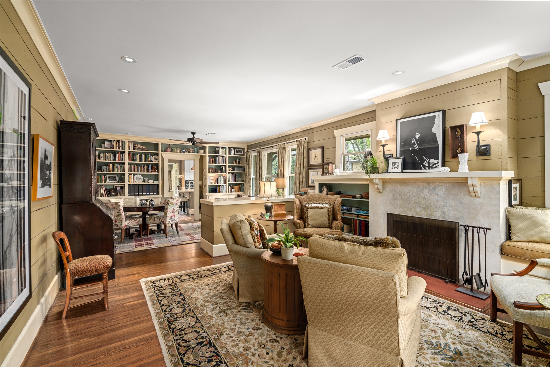 4502 Stanford Street Houston, TX 77006 - Photo 7 of 39 a living room with furniture large window and a fireplace