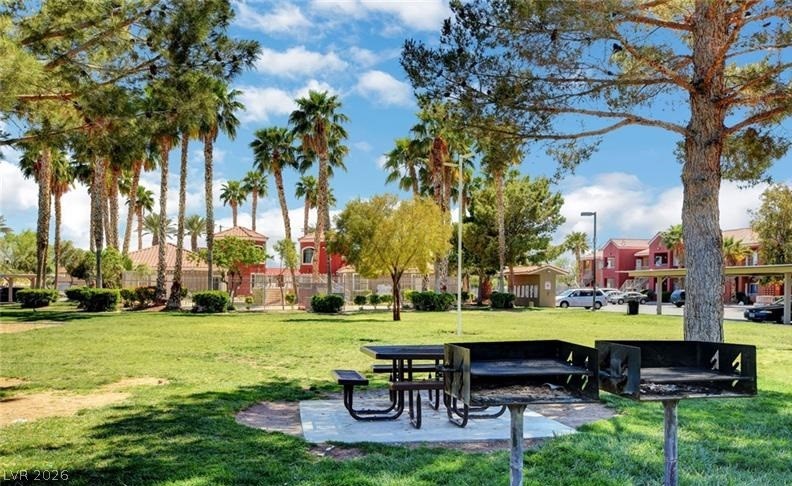 4730 East Craig Road, Unit 2102 Las Vegas, NV 89115 - Photo 8 of 13 Green spaces abound, offering tranquil retreats under towering palm trees, complete with picnic and barbecue areas.