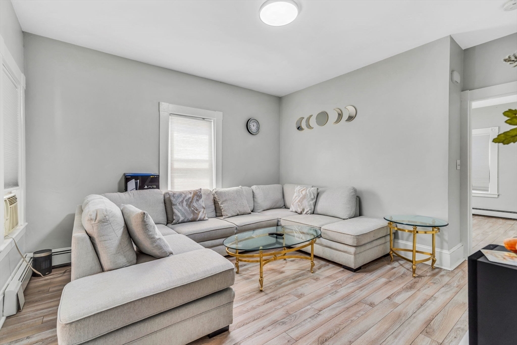 145 Maple Street Danvers, MA 01923 - Photo 13 of 27 a living room with furniture and a wooden floor