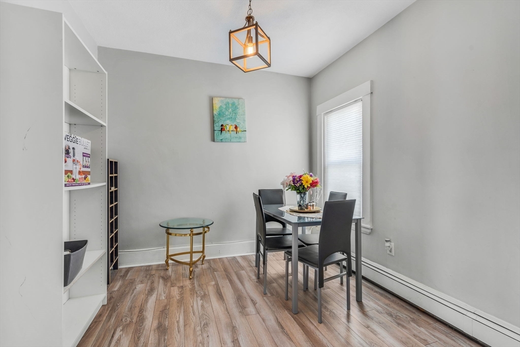 145 Maple Street Danvers, MA 01923 - Photo 17 of 27 a view of a dining room with furniture and wooden floor