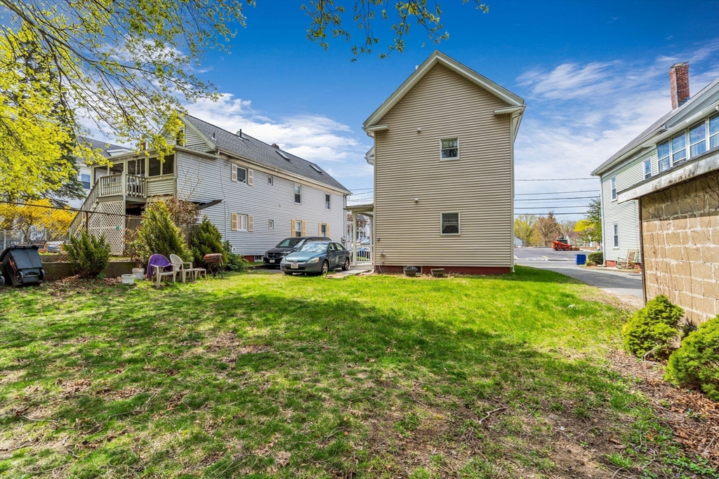 145 Maple Street Danvers, MA 01923 - Photo 2 of 27 a front view of a house with garden