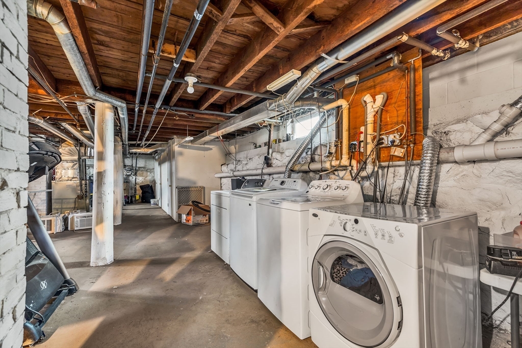 145 Maple Street Danvers, MA 01923 - Photo 23 of 27 a view of a storage room with washer and dryer