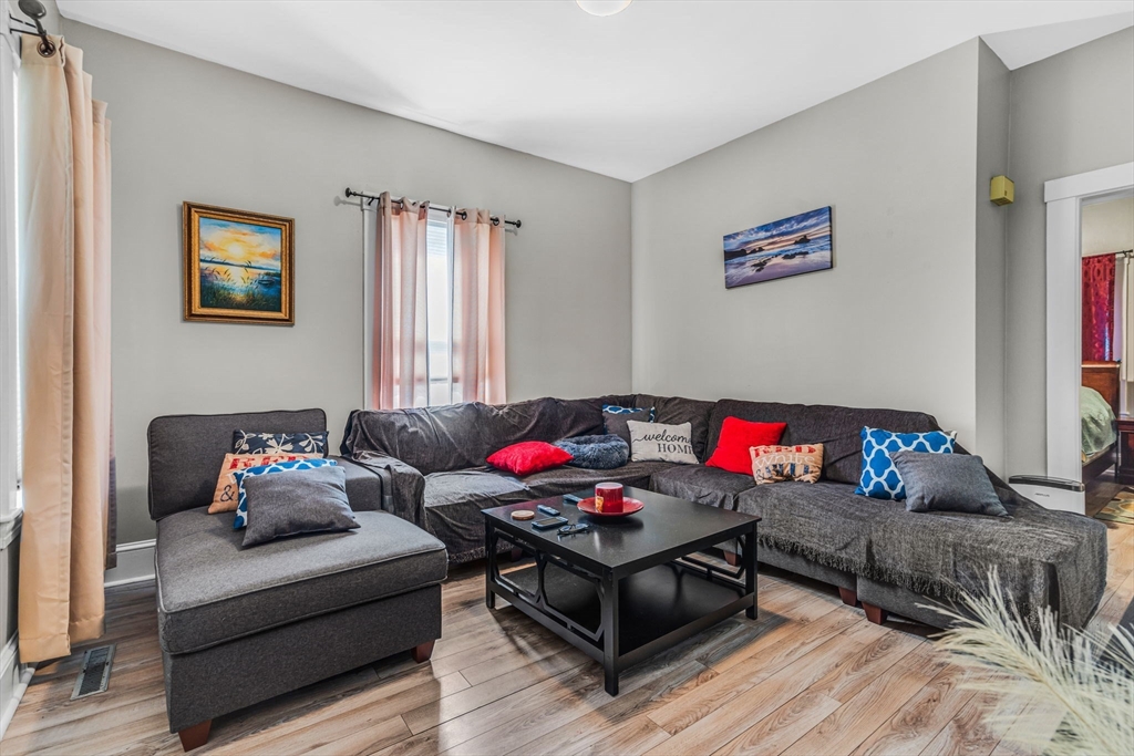 145 Maple Street Danvers, MA 01923 - Photo 4 of 27 a living room with furniture and a wooden floor