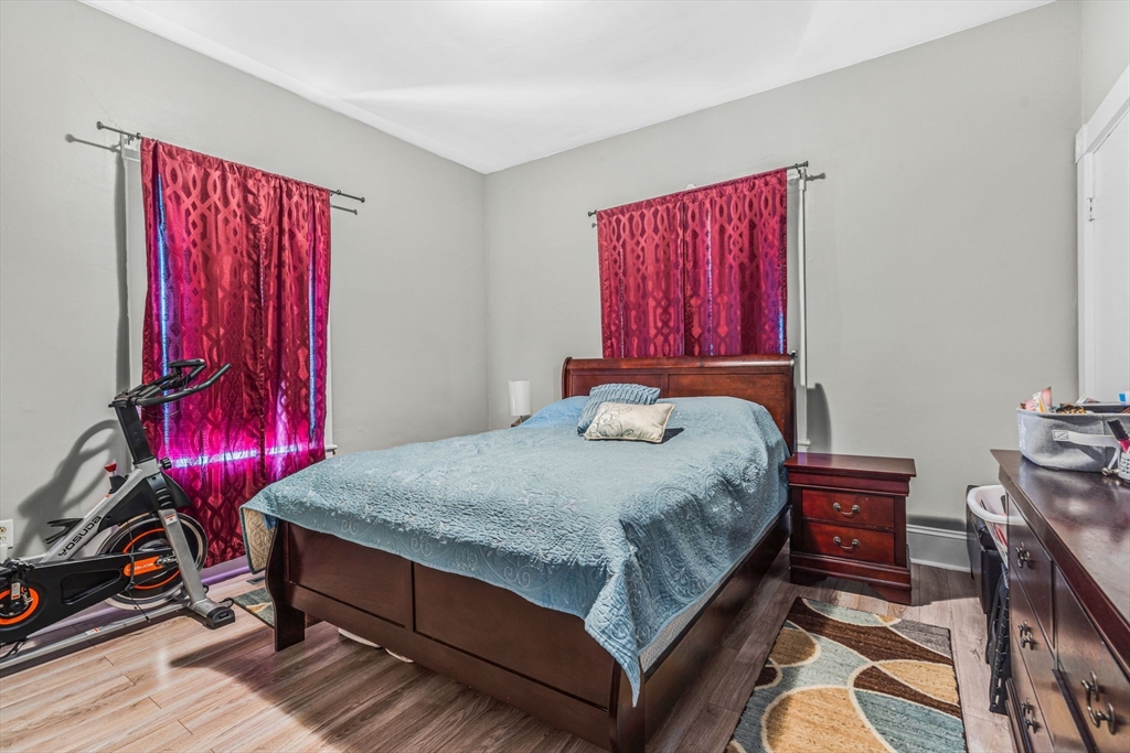 145 Maple Street Danvers, MA 01923 - Photo 10 of 27 a bed sitting in a bedroom next to a window