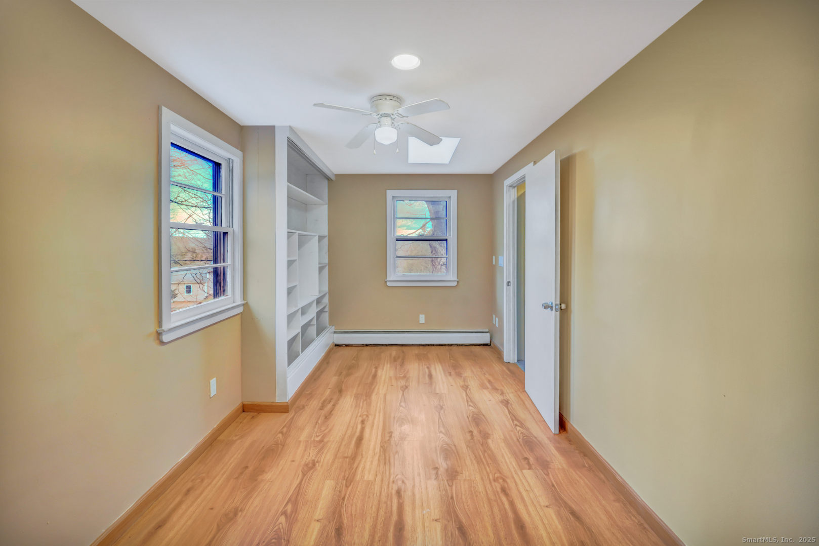 360 Old Sherman Hill Road Woodbury, CT 06798 - Photo 7 of 19 a view of an empty room with wooden floor and a window