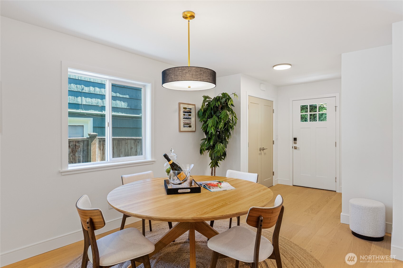 1710 Northeast 104th Street Seattle, WA 98125 - Photo 12 of 40 a view of a dining room with a table and chairs
