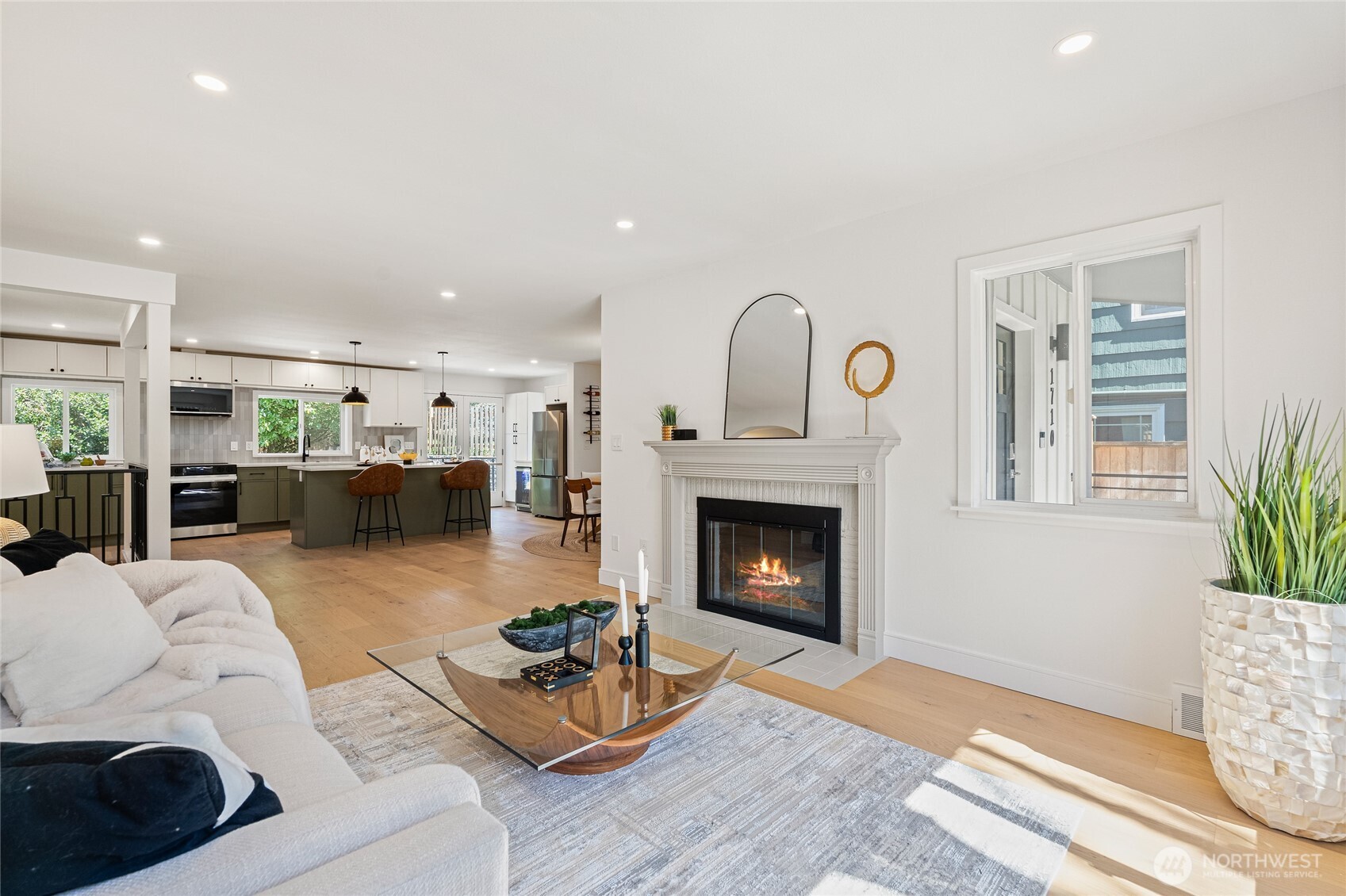 1710 Northeast 104th Street Seattle, WA 98125 - Photo 17 of 40 a living room with furniture and a fireplace