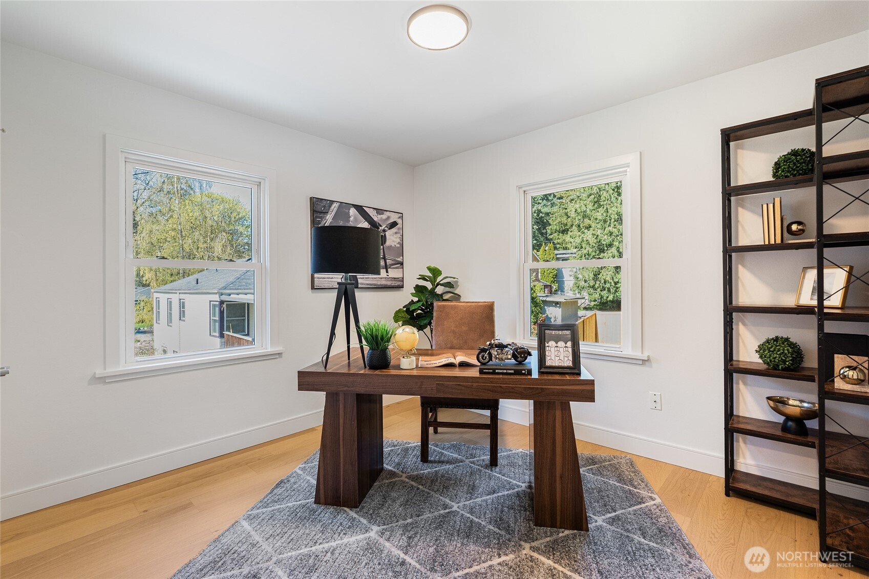 1710 Northeast 104th Street Seattle, WA 98125 - Photo 18 of 40 a view of a workspace with furniture and a window
