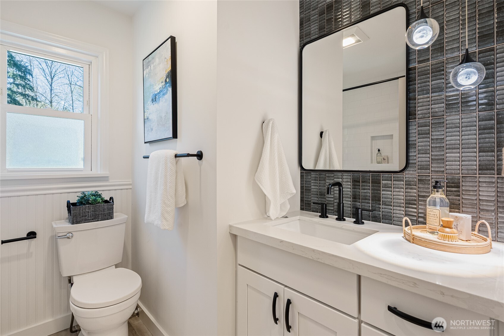 1710 Northeast 104th Street Seattle, WA 98125 - Photo 19 of 40 a bathroom with a sink toilet and mirror