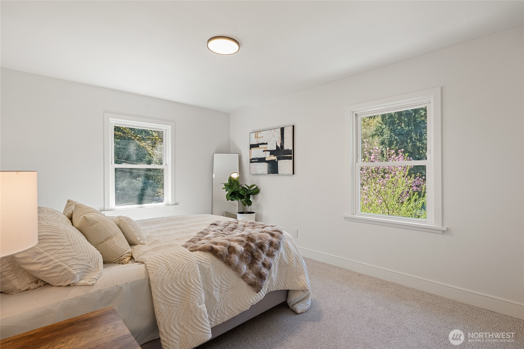 1710 Northeast 104th Street Seattle, WA 98125 - Photo 20 of 40 a bedroom with a bed and a window