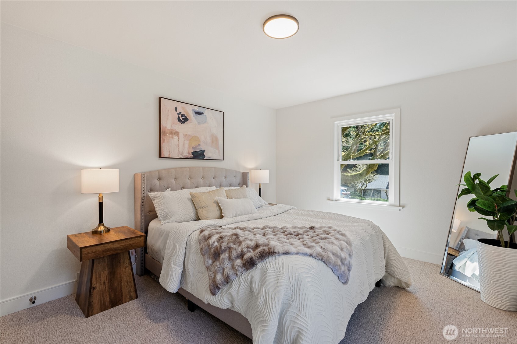 1710 Northeast 104th Street Seattle, WA 98125 - Photo 21 of 40 a bedroom with a bed and a window