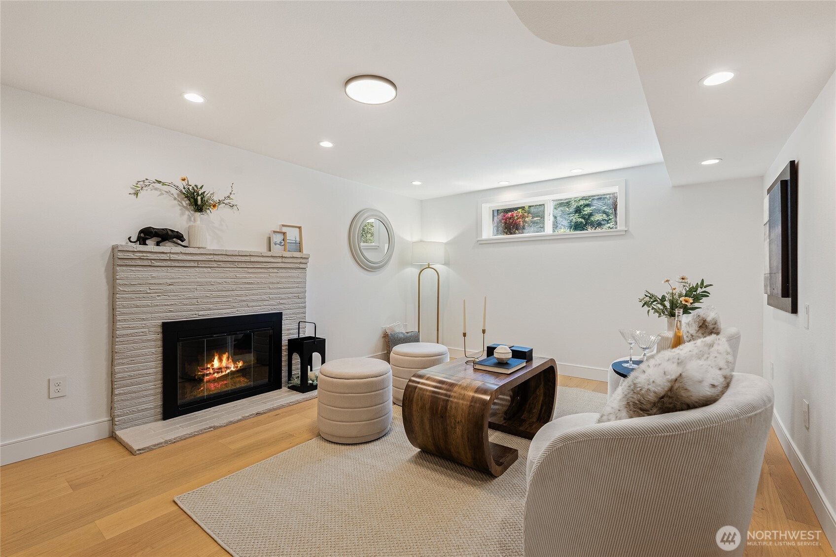 1710 Northeast 104th Street Seattle, WA 98125 - Photo 23 of 40 a living room with furniture and a fireplace