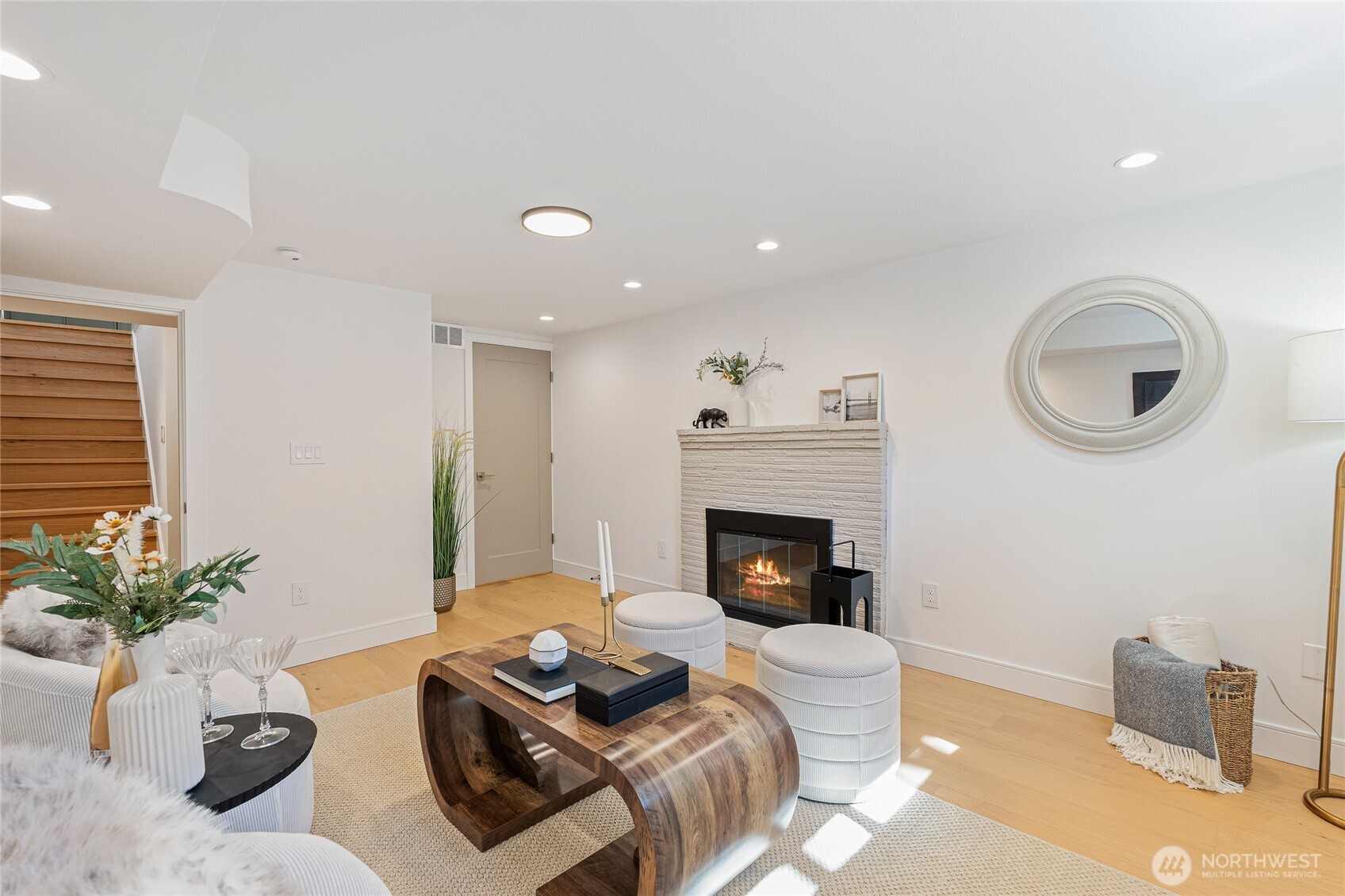 1710 Northeast 104th Street Seattle, WA 98125 - Photo 25 of 40 a living room with furniture and a fireplace