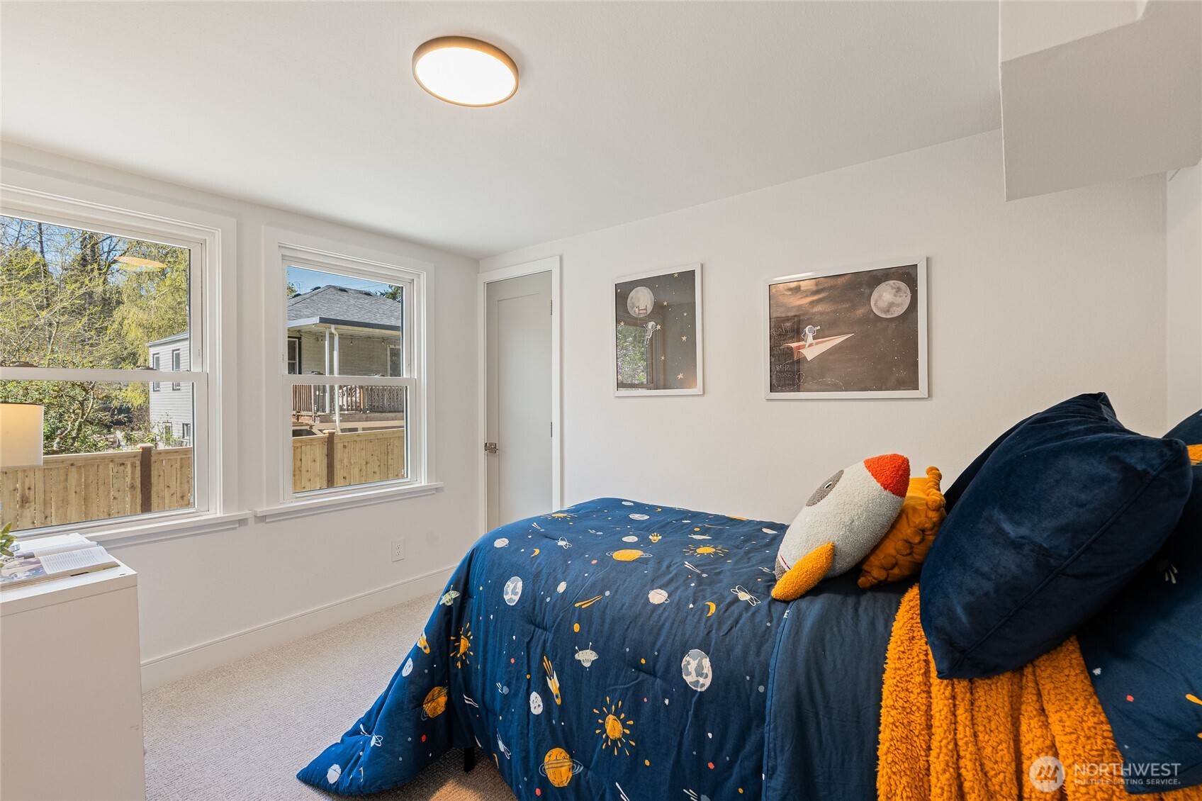 1710 Northeast 104th Street Seattle, WA 98125 - Photo 30 of 40 a bedroom with a bed and a window