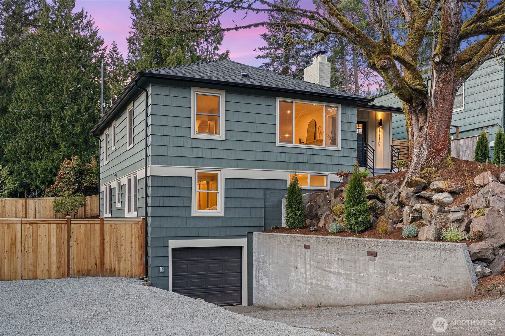 1710 Northeast 104th Street Seattle, WA 98125 - Photo 34 of 40 a front view of a house with a tree