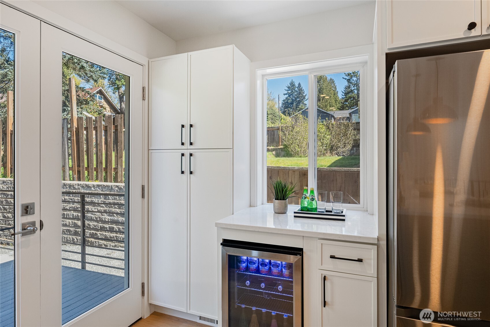 1710 Northeast 104th Street Seattle, WA 98125 - Photo 9 of 40 a kitchen with stainless steel appliances a refrigerator and a window