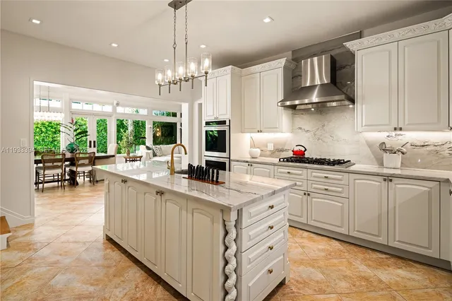 a kitchen with stainless steel appliances granite countertop a sink and cabinets