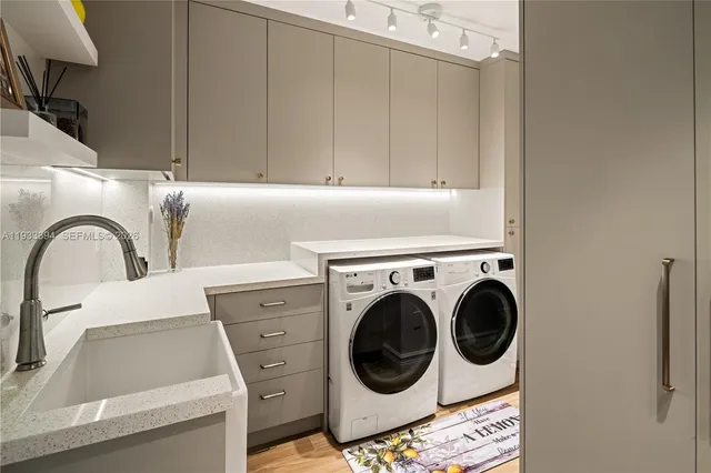 a utility room with dryer and washer