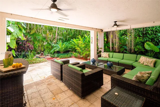 a outdoor living space with furniture and garden view