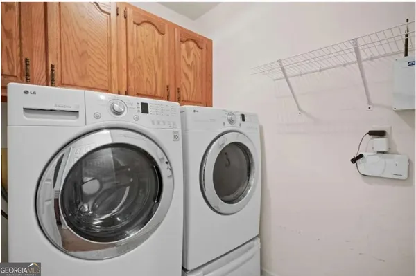 a utility room with dryer and washer