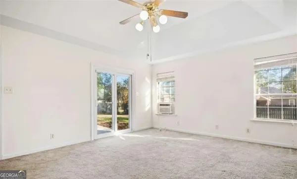 a view of an empty room with a window