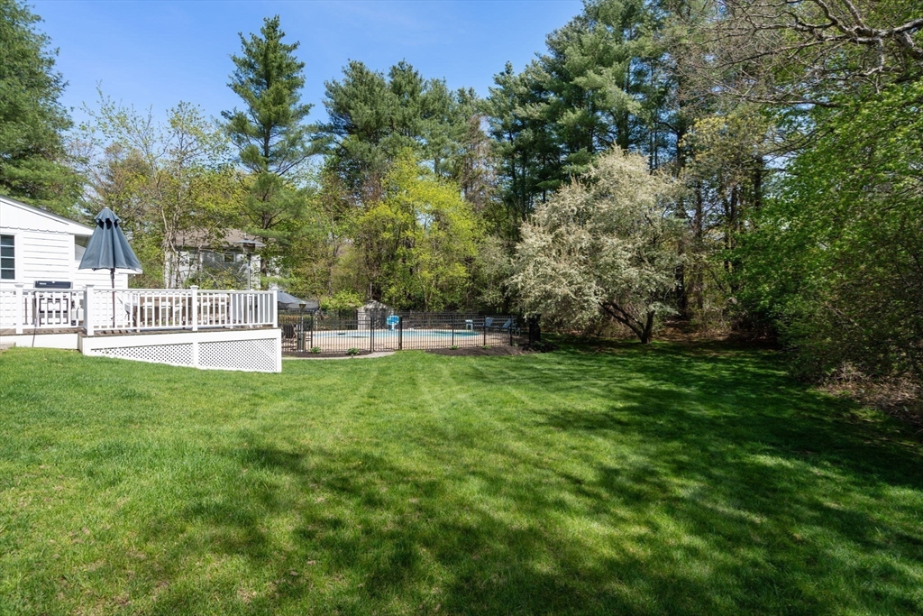 54 Red Barn Road Wayland, MA 01778 - Photo 2 of 2 a view of a park with bench and trees