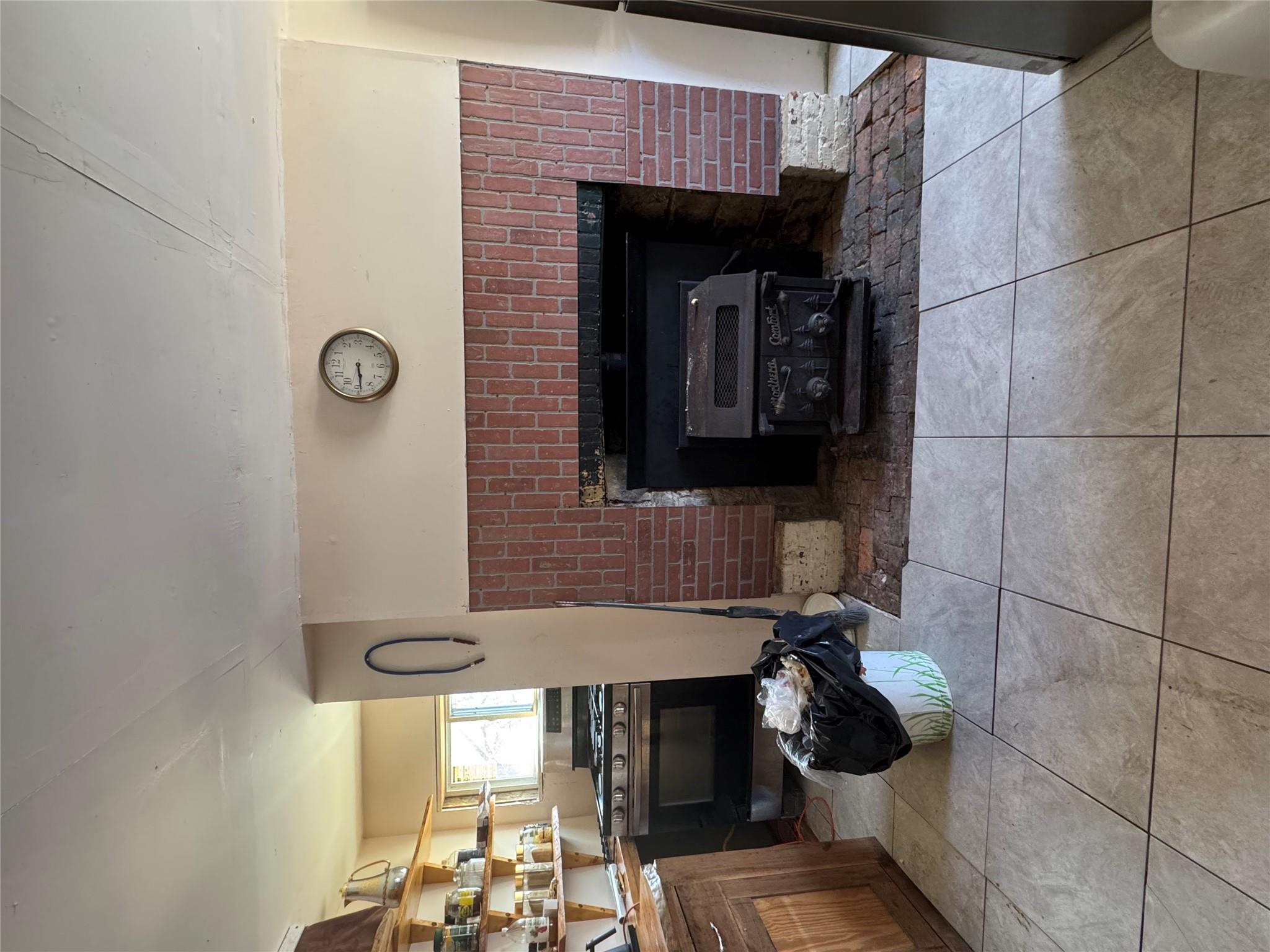 50 Hamilton Road Bloomingburg, NY 12721 - Photo 13 of 33 Room details featuring stove and a fireplace