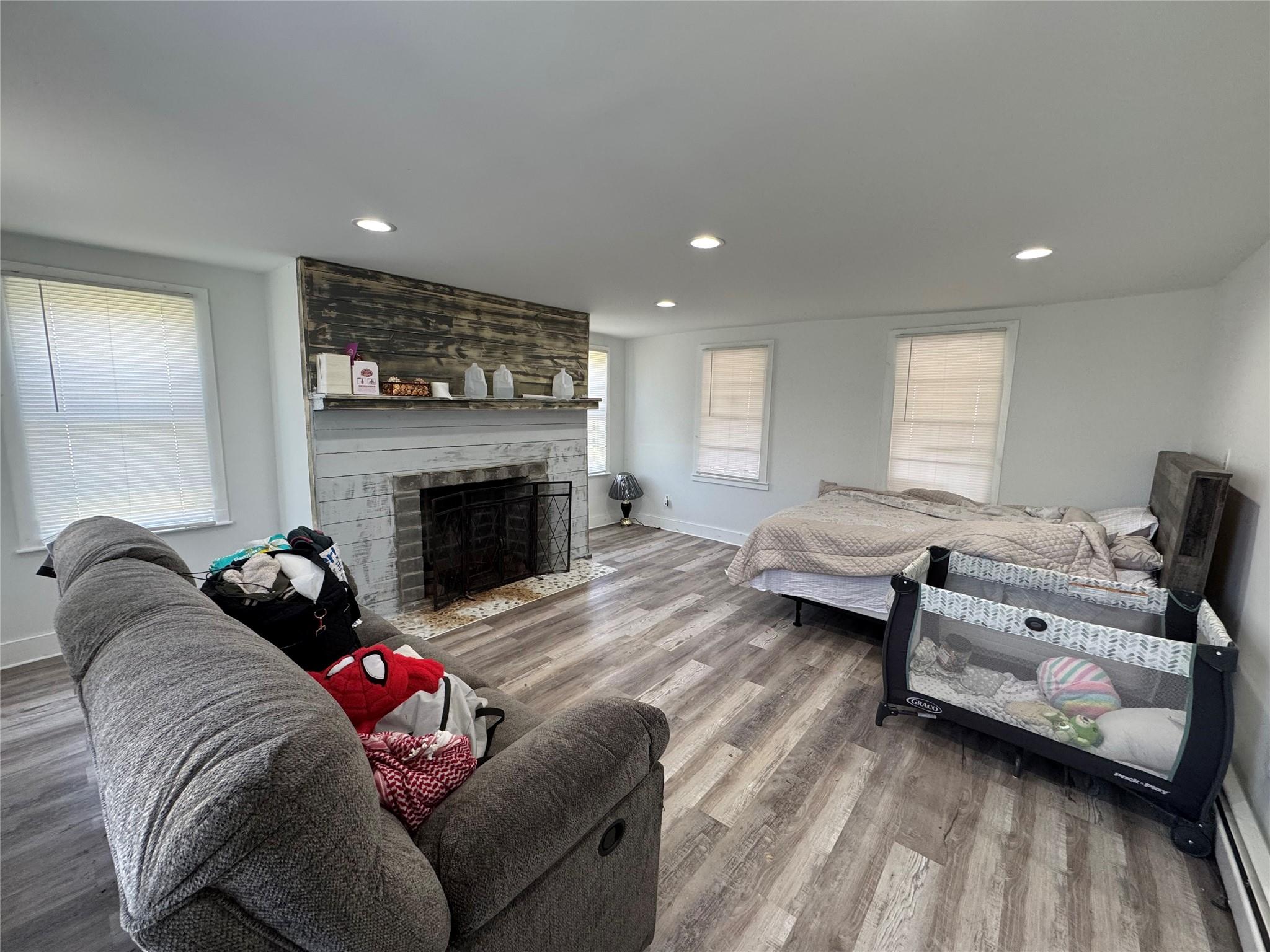 50 Hamilton Road Bloomingburg, NY 12721 - Photo 4 of 33 Living room with baseboards, recessed lighting, wood finished floors, and a fireplace