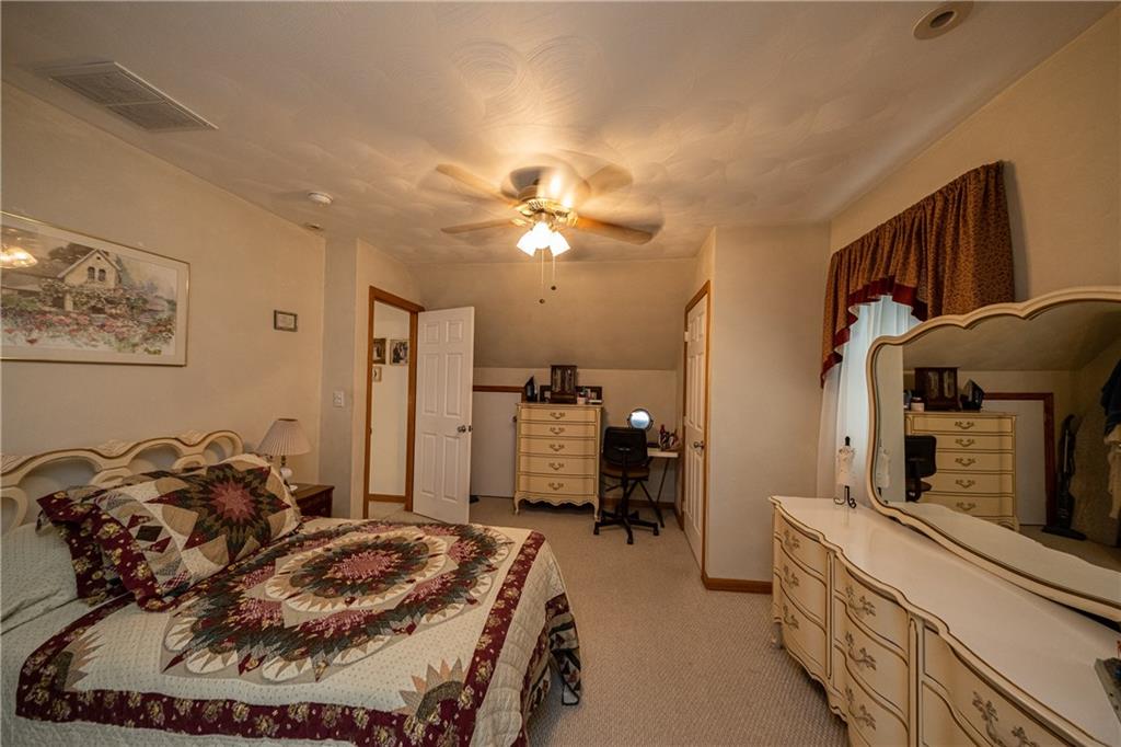 6050 Poketa Road Verona, PA 15147 - Photo 19 of 25 Neutral colored with great closet space and a ceiling fan.