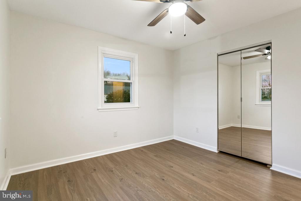 9 Oberlin Road Pennsville, NJ 08070 - Photo 13 of 23 a view of an empty room with wooden floor and a window