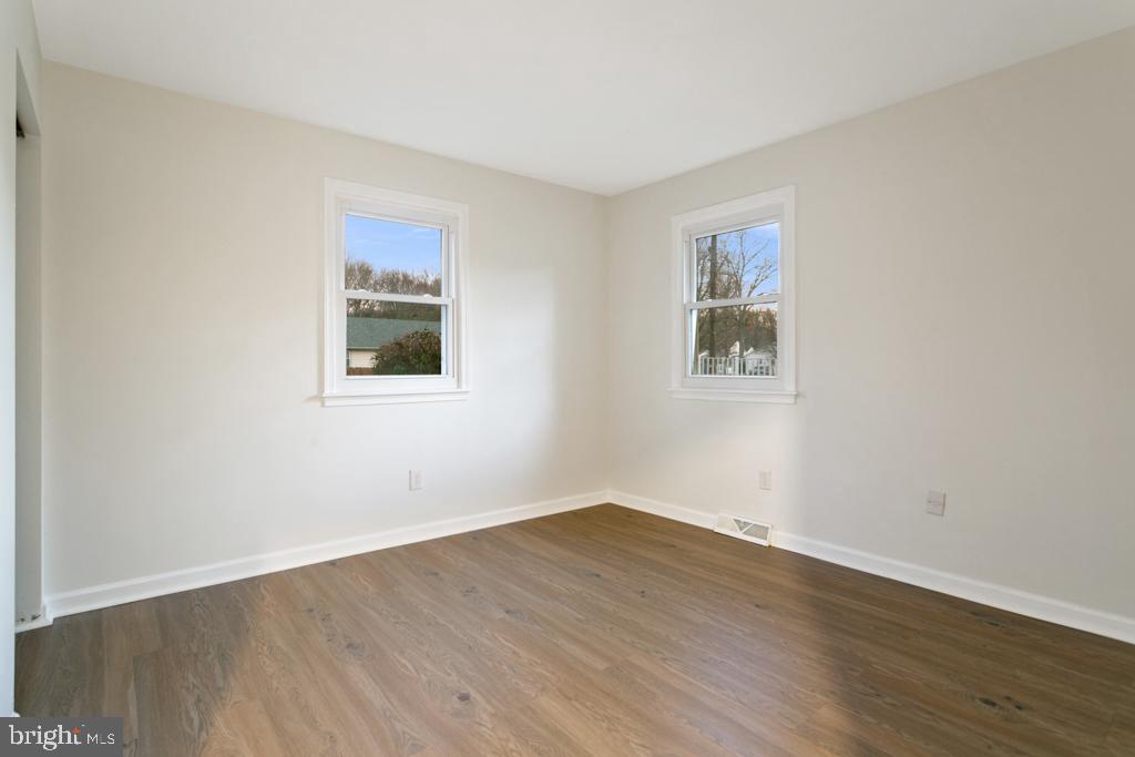 9 Oberlin Road Pennsville, NJ 08070 - Photo 16 of 23 a view of a room with wooden floor and windows