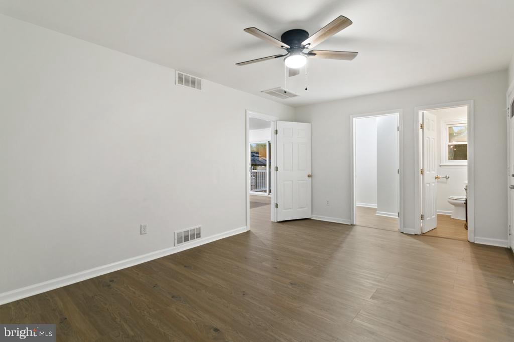9 Oberlin Road Pennsville, NJ 08070 - Photo 20 of 23 an empty room with wooden floor and ceiling fan