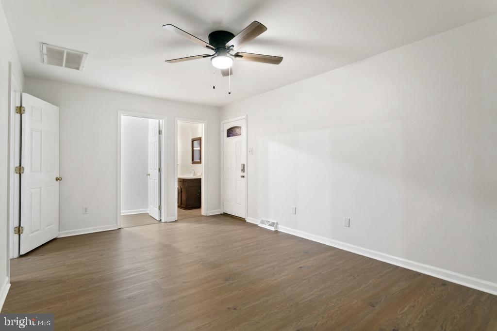 9 Oberlin Road Pennsville, NJ 08070 - Photo 21 of 23 an empty room with wooden floor and ceiling fan