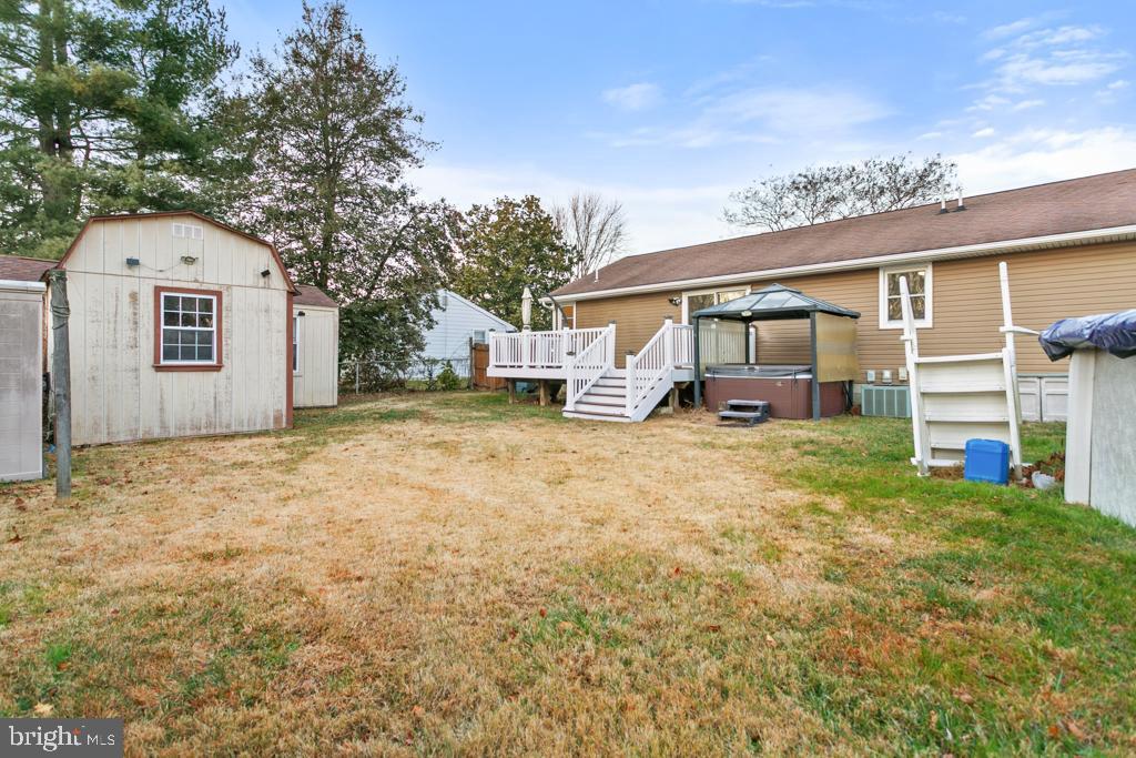 9 Oberlin Road Pennsville, NJ 08070 - Photo 22 of 23 a view of a house with a backyard and a tree