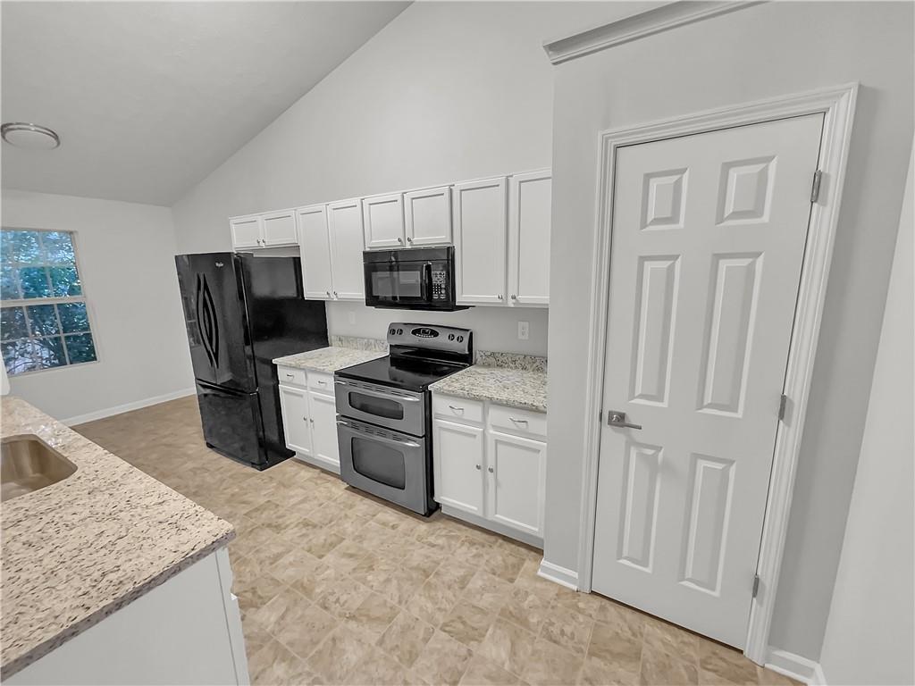 3624 Summit Pines Decatur, GA 30034 - Photo 2 of 21 a kitchen with stainless steel appliances granite countertop a sink stove and refrigerator