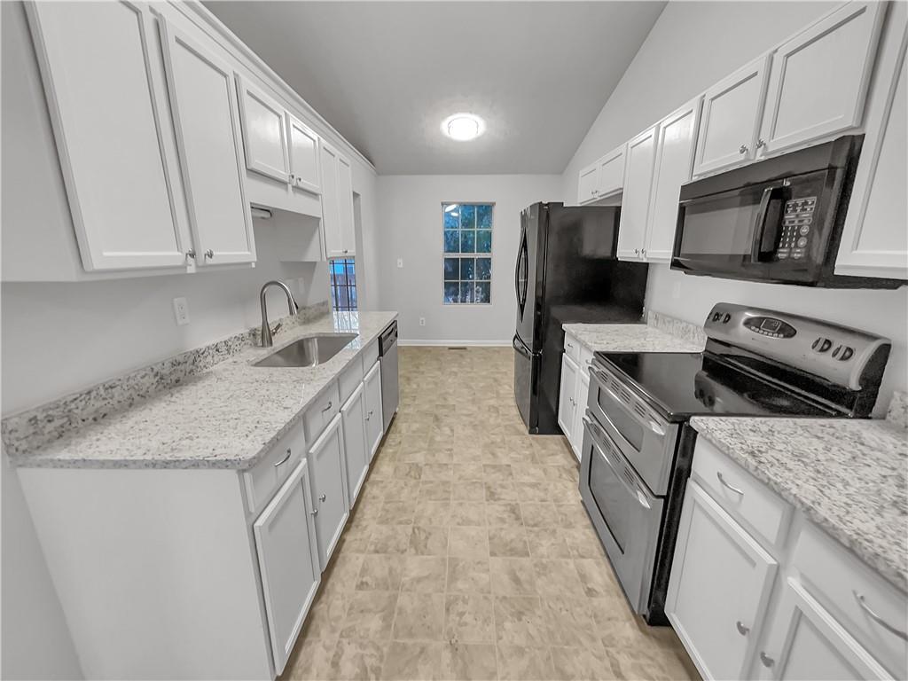 3624 Summit Pines Decatur, GA 30034 - Photo 10 of 21 a kitchen with stainless steel appliances granite countertop a sink stove and refrigerator