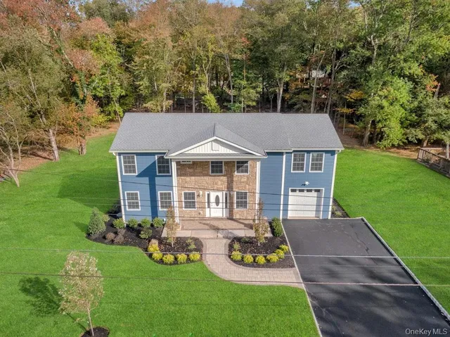 a aerial view of a house with table and chairs