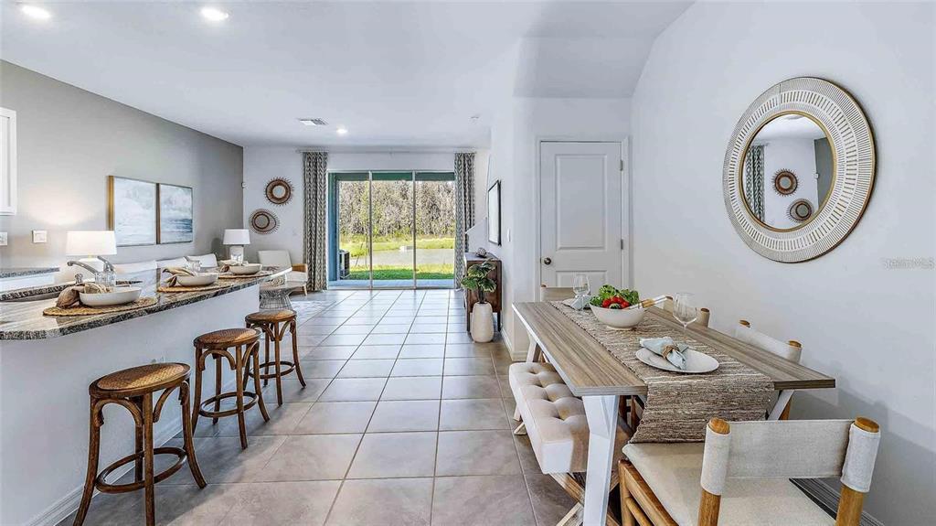32311 Turtle Grace Loop Wesley Chapel, FL 33545 - Photo 3 of 23 a very nice looking dining room with a table and chairs