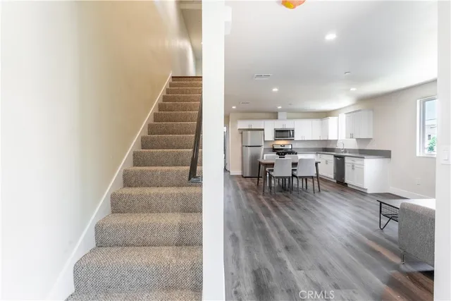 a view of kitchen with cabinets and wooden floor