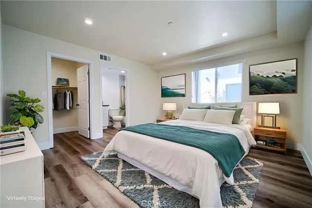 a bed room with a bed and a television