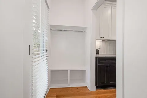 a view of walk in closet with empty racks