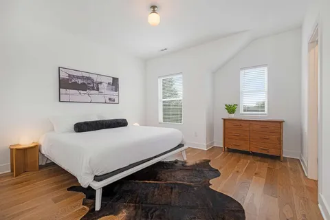 a bedroom with a bed and a view of bedroom