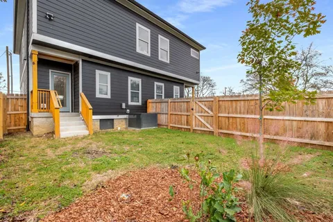 a backyard of a house with lots of green space